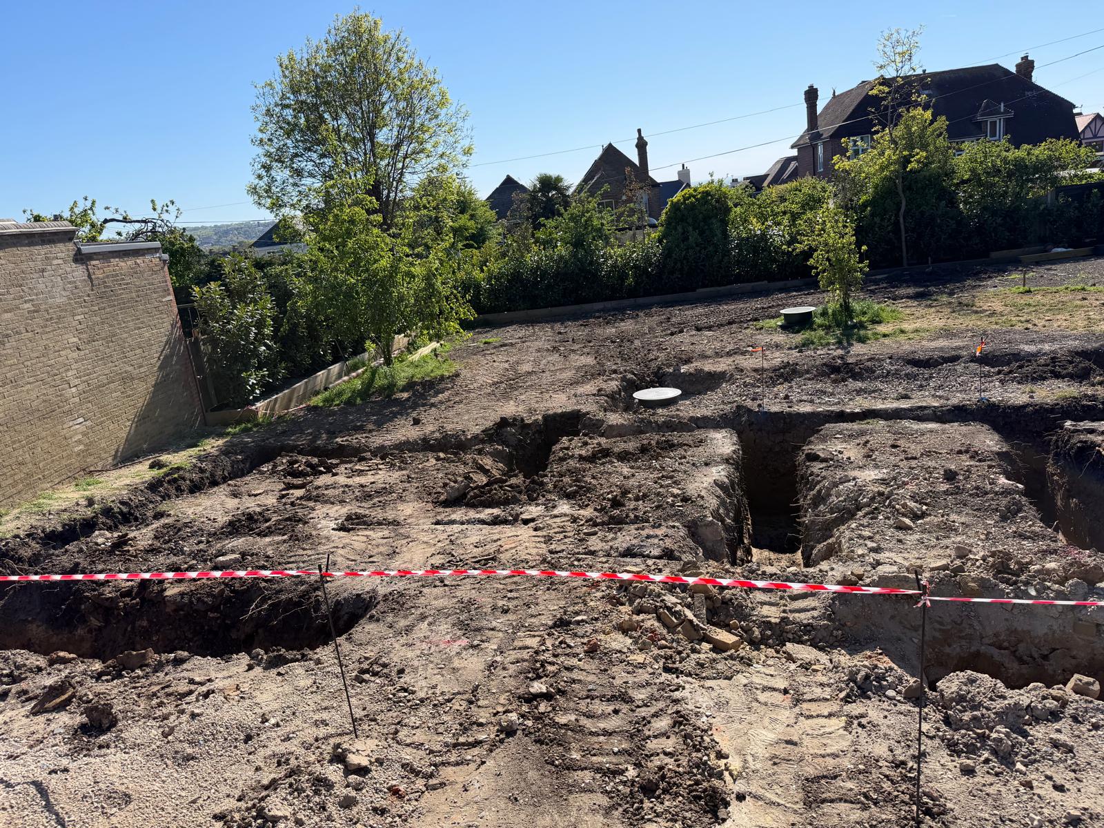Strip footing excavation and drainage manholes on a commercial groundworks site
