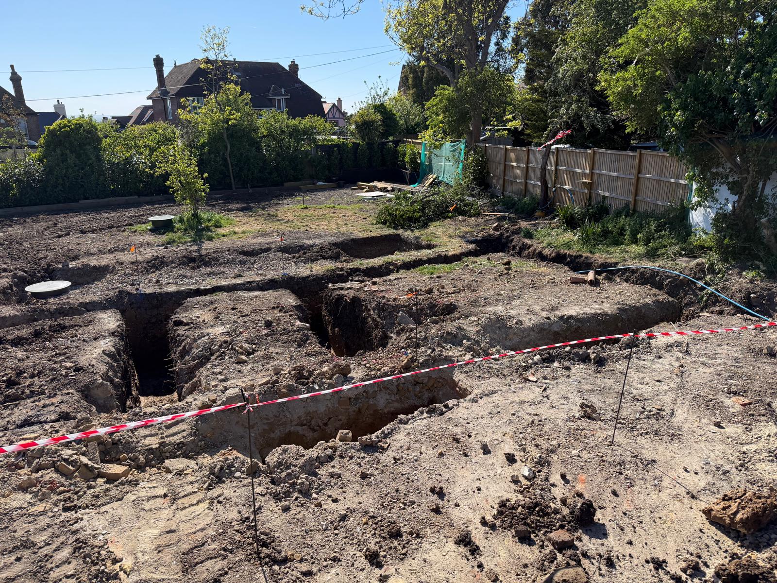 Commercial foundation layout taped off after excavation of multiple strip footings