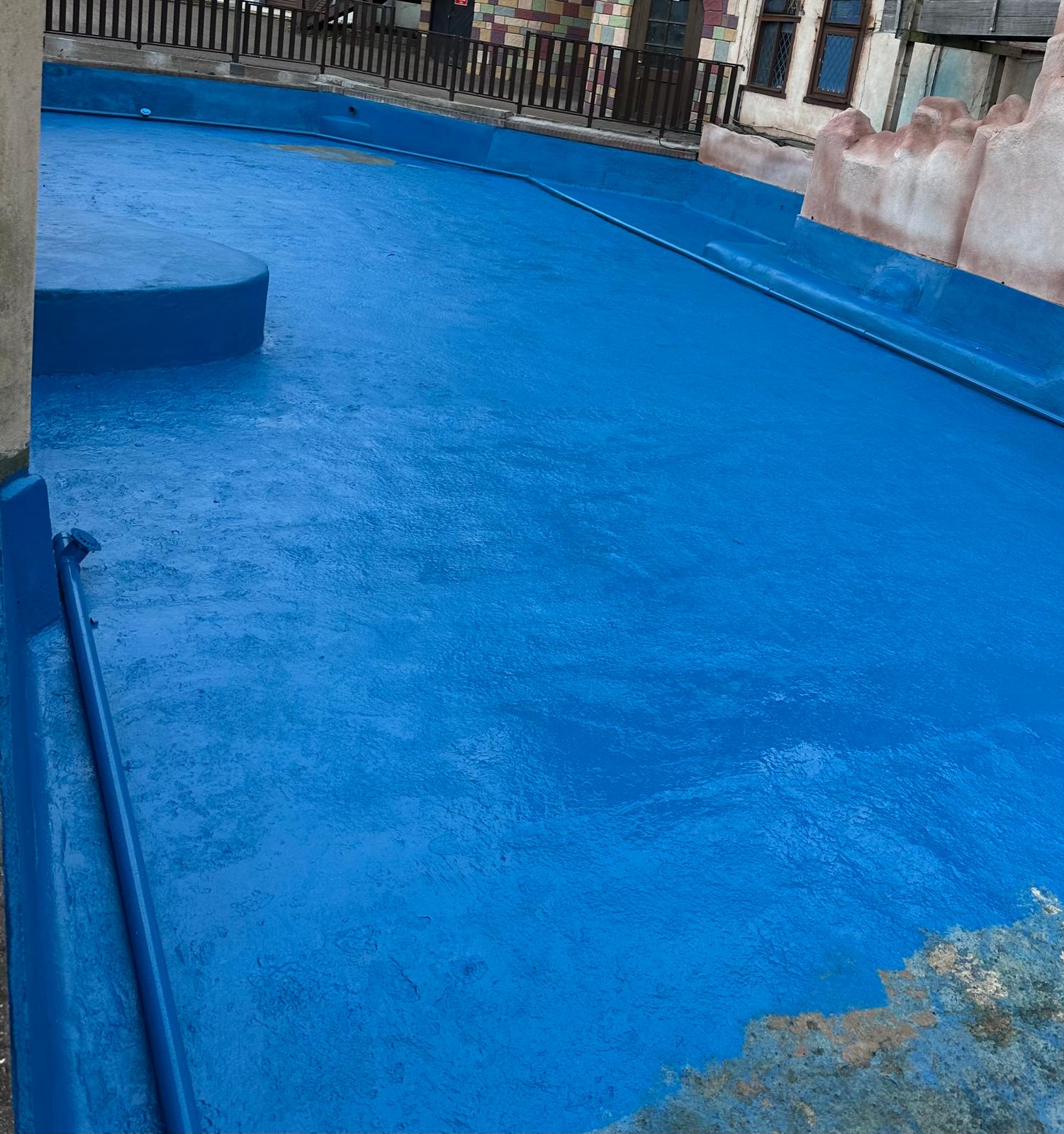 Commercial pond renovation: draining, preparing and recoating a feature pond