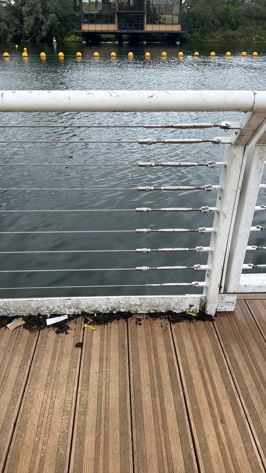 White metal posts on a timber deck prepared for new stainless steel safety wires