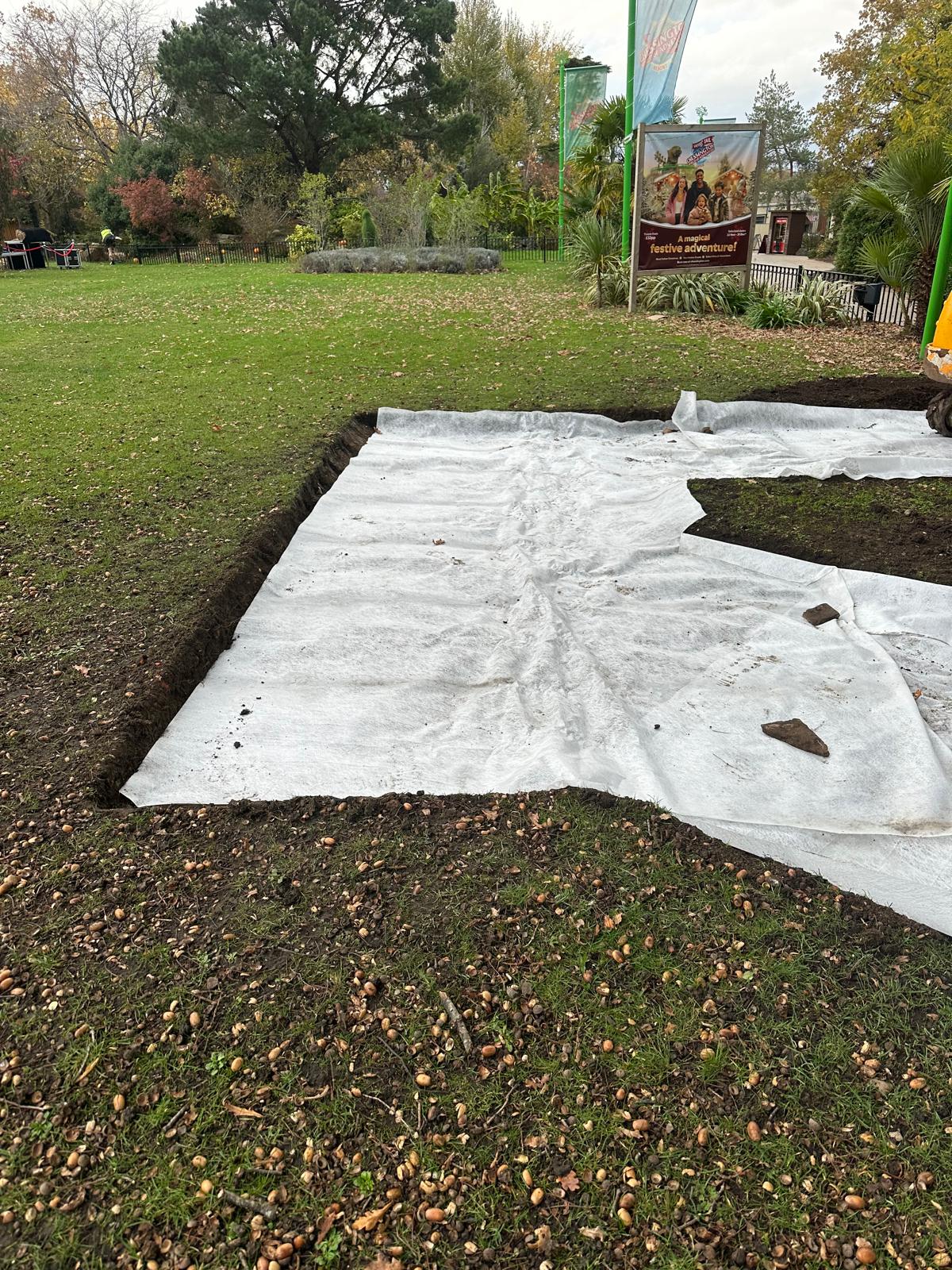 Groundworks team preparing the public footpath excavation through landscaped grounds