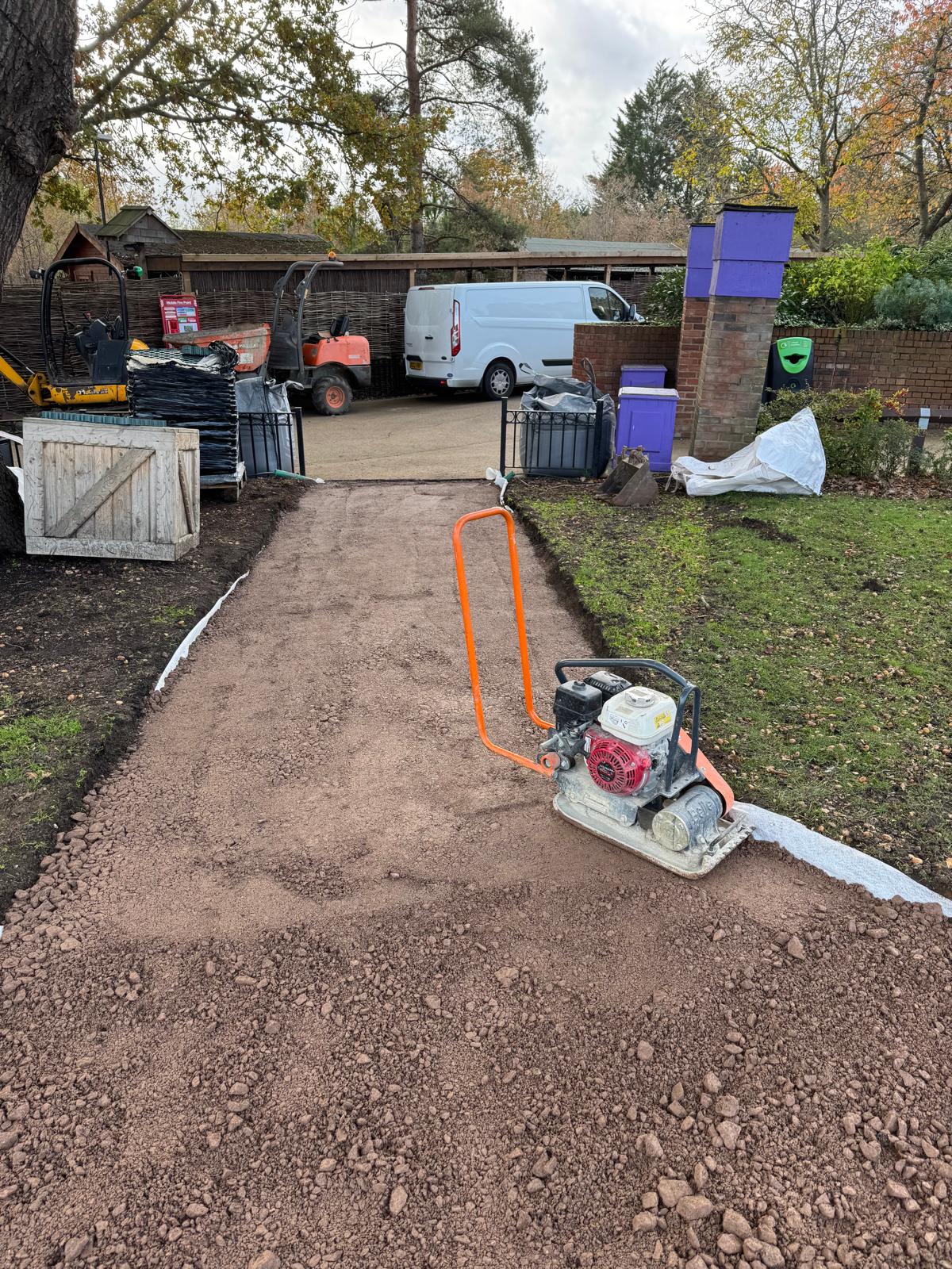 Plate compactor consolidating type 1 sub-base on a new commercial footpath