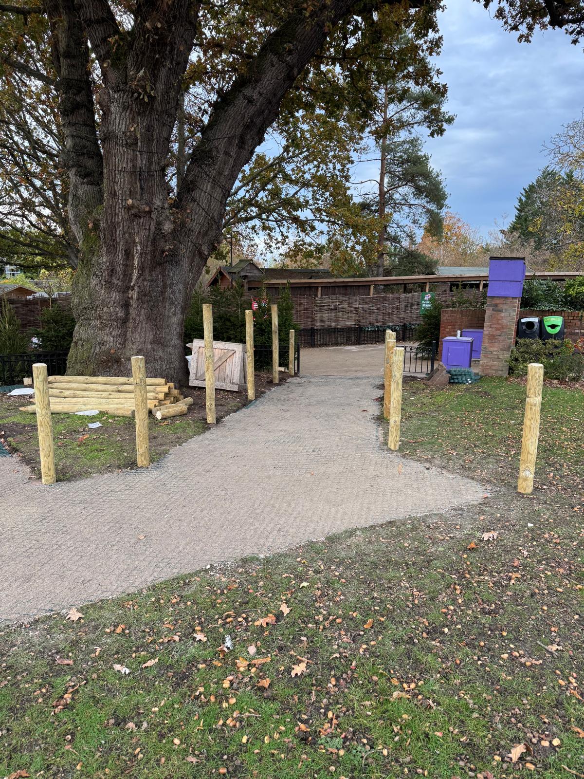 Compacted sand wearing course on the new footpath with timber posts set for a rope barrier