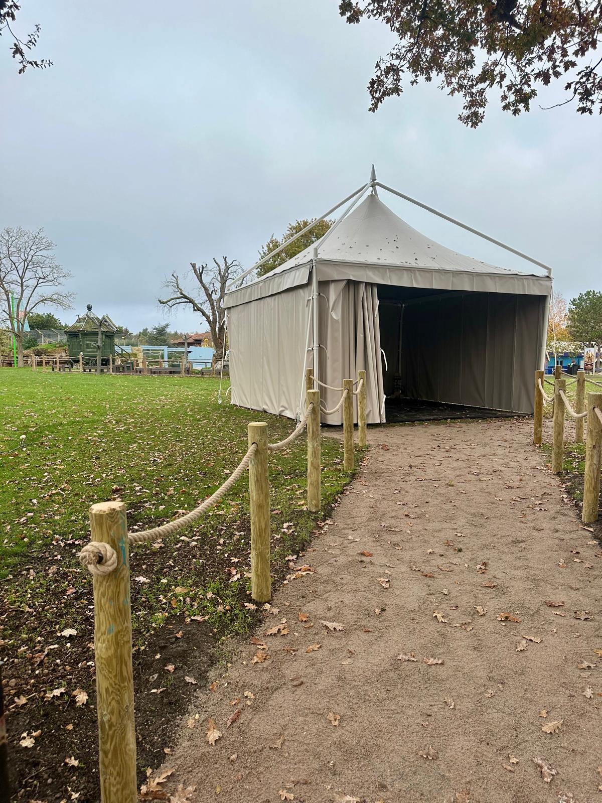 Completed commercial pedestrian path with timber rope fencing approaching an event tent